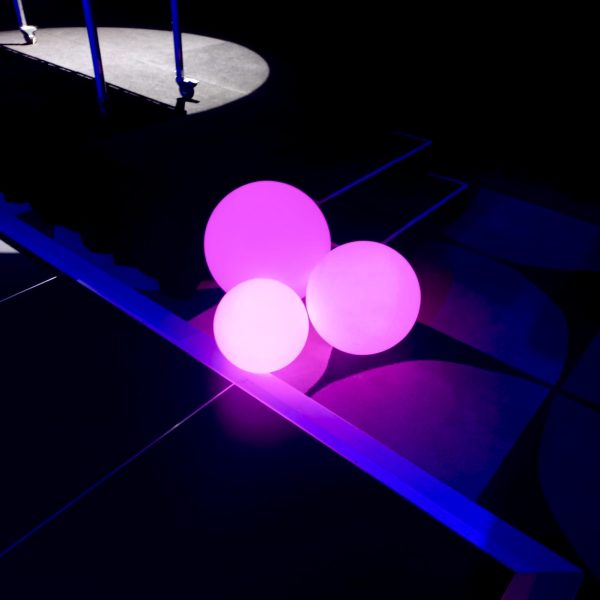 3 round spheres glowing in pink