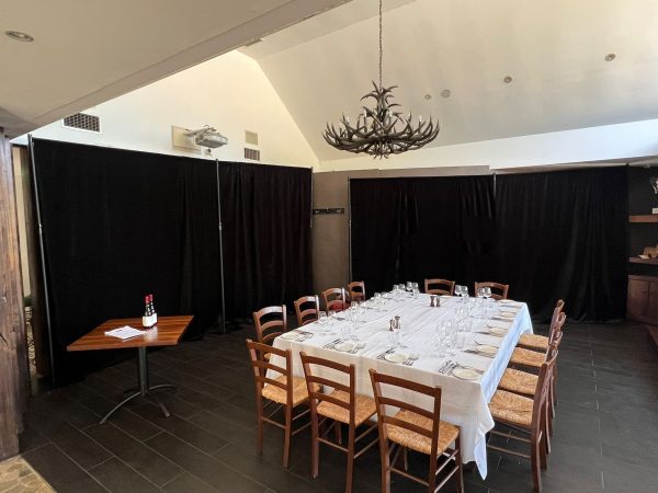 black drape velvet backdrop at an indoor event