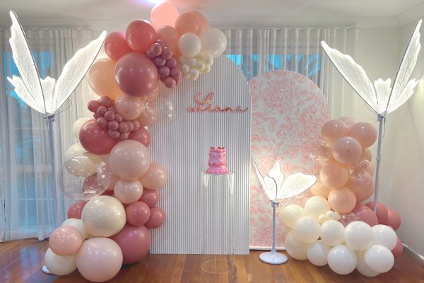 pink and white balloon garland for a 2nd birthday party